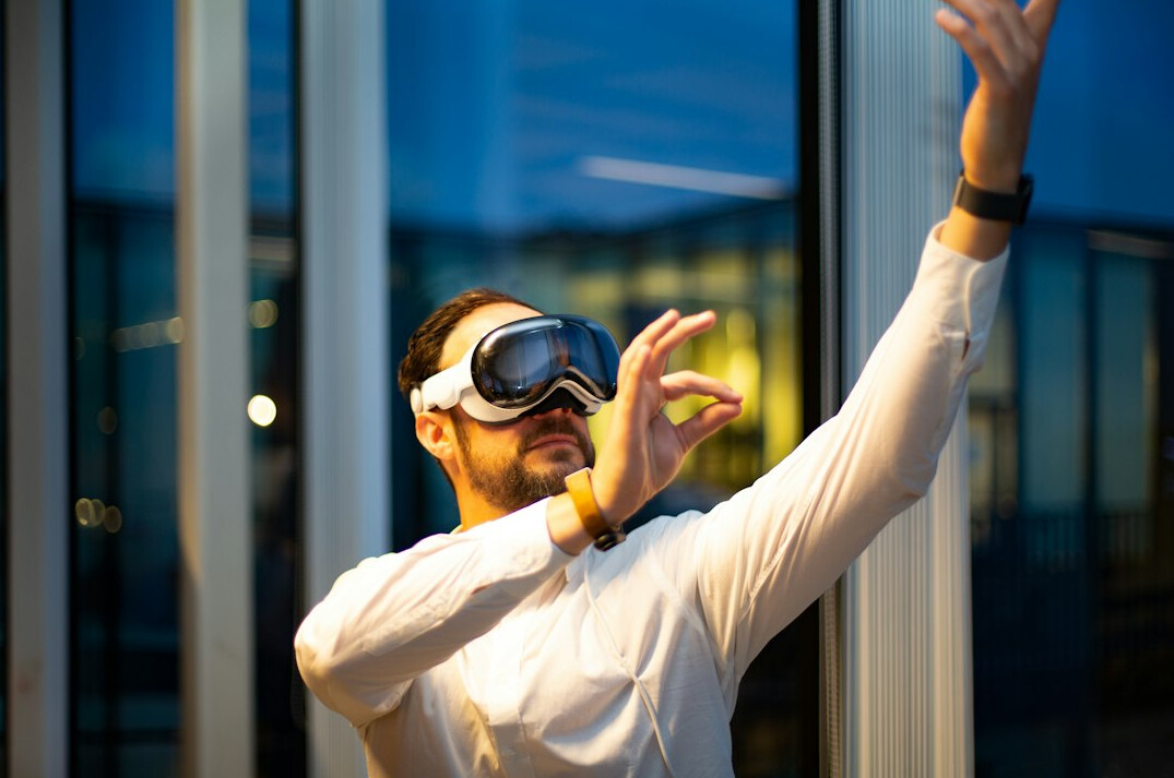 Employee taking a mindful break near a window in an office