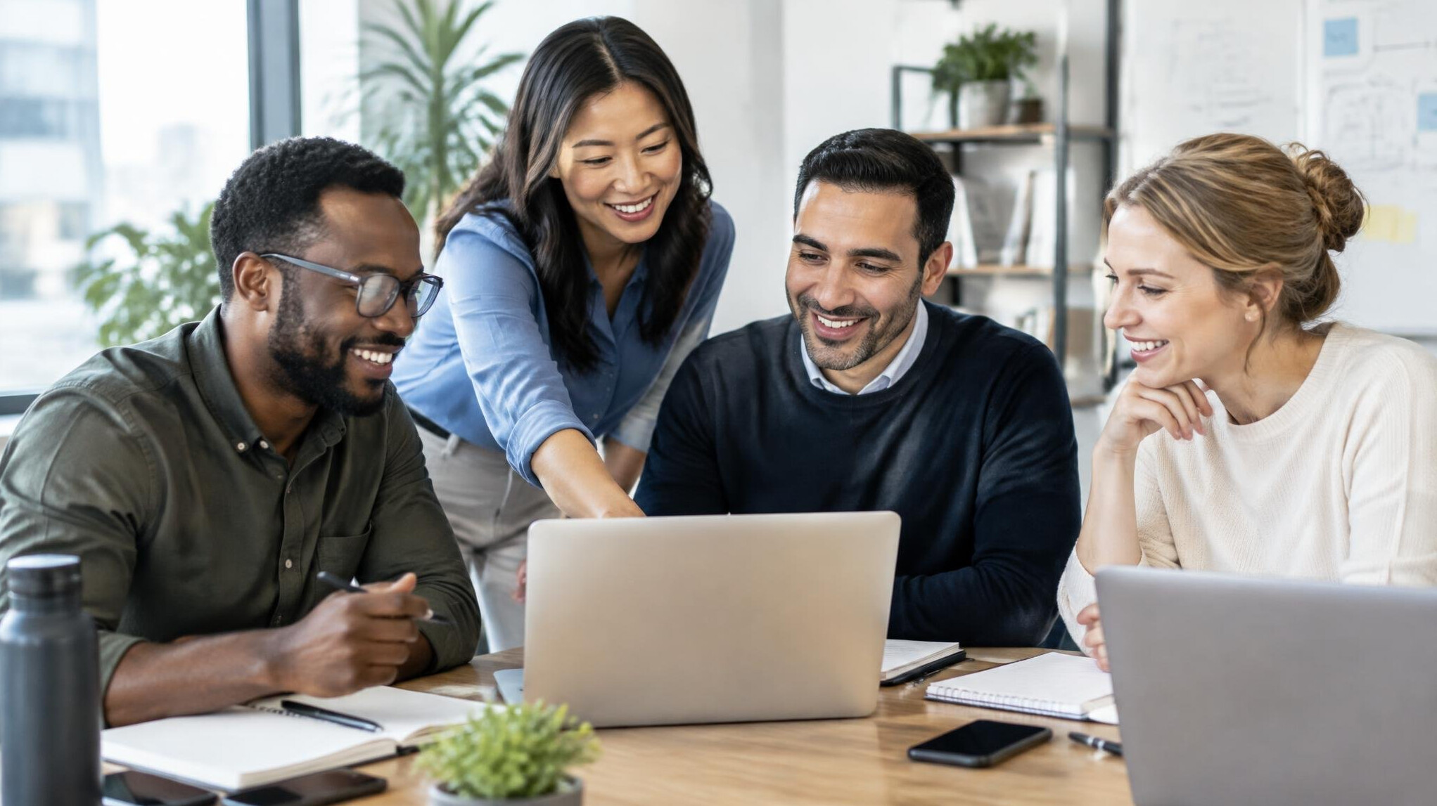 Diverse group of coworkers collaborating around a table